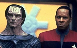 Gul Dukat and Commander Sisko strike a deal to end the weapons shipments to the DMZ and stop the Maquis.